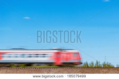 Highspeed train moves on the hill on blue sky background