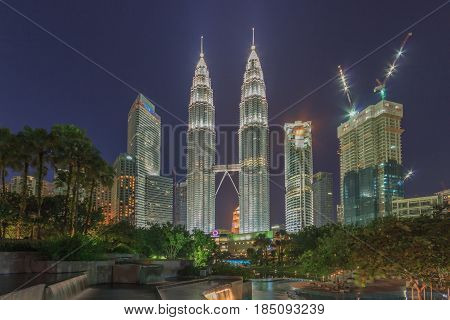 KUALA LUMPUR, MALAYSIA - AUGUST 13: Petronas Twin Towers at night on August 13, 2016 in Kuala Lumpur. Petronas Twin Towers were the tallest buildings (452 m) in the world from 1998 to 2004.