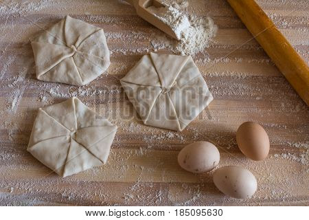 Pastries With Cheese, Domestic Eggs, Wooden Rolling Pin On A Wooden Board