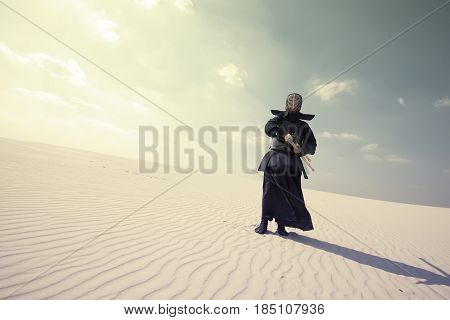 Warrior In Traditional Armor For Kendo In A Desert