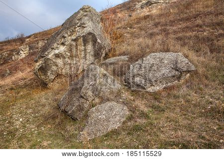 big rocks on the base of the mountains after rockfall