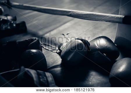 Boxing gloves in the ring. hign contrast and monochrome color tone. Toning.