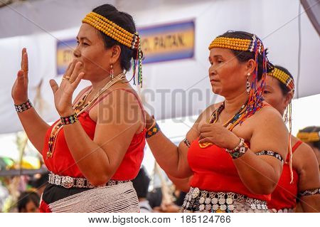 Penampang,Sabah-May 30,2016:Women of Sabah,Borneo Kadazandusun ethnic in their traditional costumes performs traditional dance during Harvest Festival at Penampang,Sabah,Malaysia