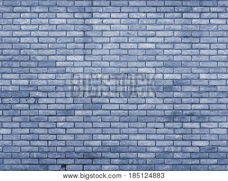 blue toned brick wall with repeating pattern