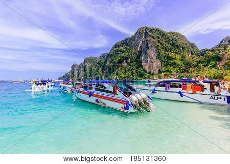 KOH PHI PHI, THAILAND - JULY 23: Motor boats on turquoise water of Maya Bay lagoon on July 23, 2016 in Koh Phi Phi island Thailand.