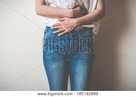 Women Touching Lower Abdomen