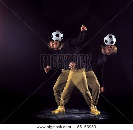 A portrait of a fan with ball on gray studio background. Freestile concept. Stroboscope shooting technique