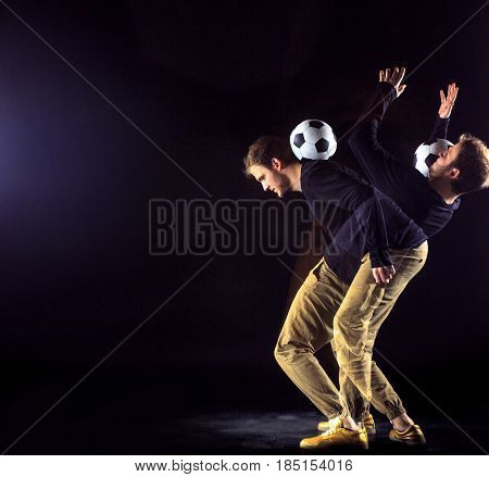 A portrait of a fan with ball on gray studio background. Freestile concept. Stroboscope shooting technique