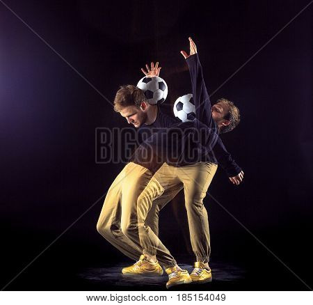 A portrait of a fan with ball on gray studio background. Freestile concept. Stroboscope shooting technique