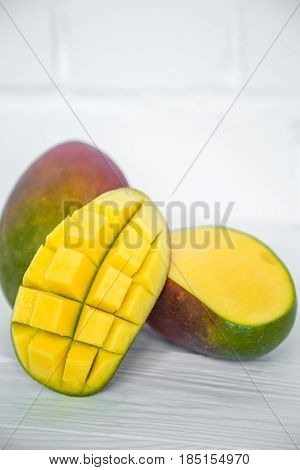 Mango On A White Wooden Background
