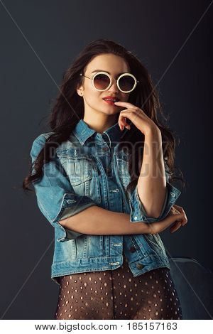 Gorgeous Girl With Red Lipstick And White Sunglasses Dressed In A Blue Jacket Red High Heel Shoes An