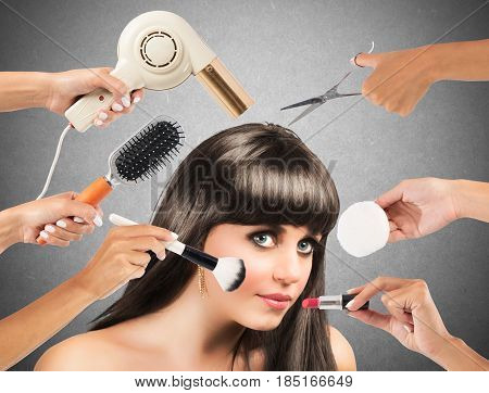 Girl made up and coiffed by many hands