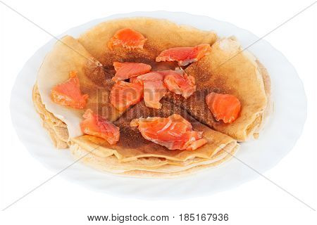 Plate of delicious and healthy crepes made from whole wheat flour with red fish isolated on white background closeup