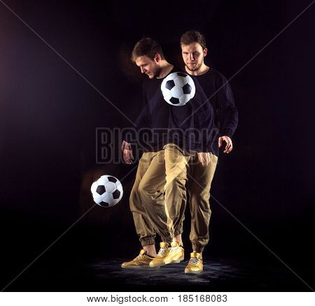 A portrait of a fan with ball on gray studio background. Freestile concept. Stroboscope shooting technique