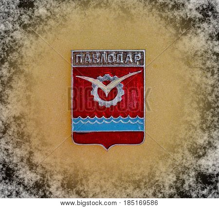 USSR - circa 1977: Badge with the coat of arms of the city of Pavlodar, from the series 