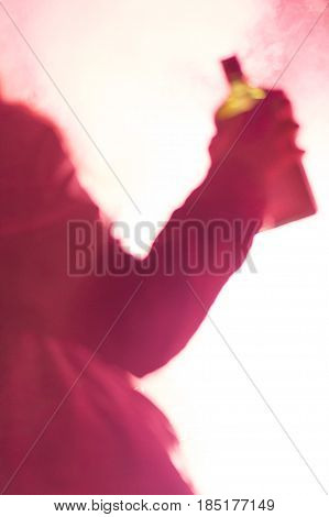 People open air party. Drinking on the party, silhouette of woman on fireworks highlights