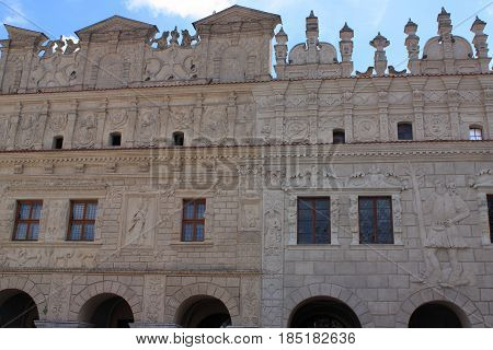 Townhouses under St. Mikolaj and Krzysztof in Kazimierz Dolny on the Vistula River (Poland). Historical tenement houses of the 17th century with an identical façade decorated with bas-reliefs of human and animal figures as well as plant ornaments. The roo