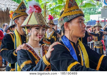 Penampang,Sabah-May 30,2016:Group of Sabah,Borneo Kadazandusun ethnic in their traditional costumes performs traditional dance during Harvest Festival at Penampang,Sabah,Malaysia