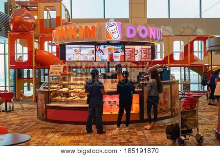 SINGAPORE - CIRCA SEPTEMBER, 2016: Dunkin Donuts at Singapore Changi Airport. Changi Airport is one of the largest transportation hubs in Southeast Asia.