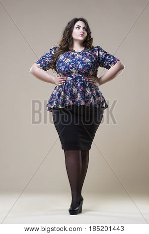 Plus size fashion model in casual clothes fat woman on beige studio background overweight female body full length portrait