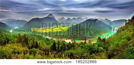 Jiulong waterfall at sunset in Luoping China.