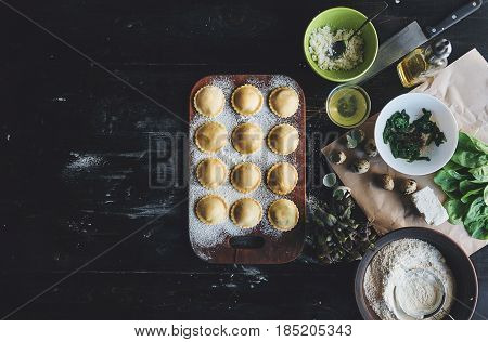 Step By Step The Chef Prepares Ravioli With Ricotta Cheese, Yolks Quail Eggs And Spinach With Spices
