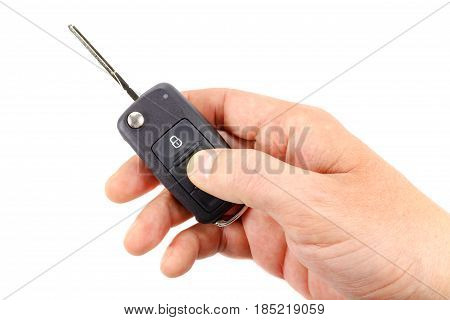 Opened ignition key in the man's hand on a white background