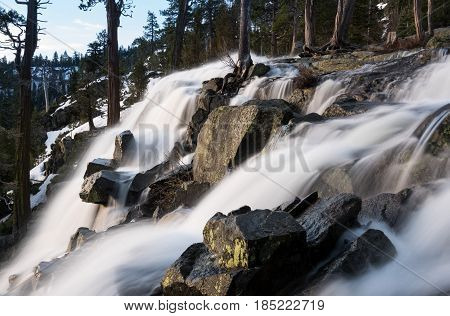 Sunrise at Emerald Bay on Lake Tahoe from the top of Lower Eagle Falls. Torrent of water from snow melt flows into the lake from Sierra Nevada Mountains