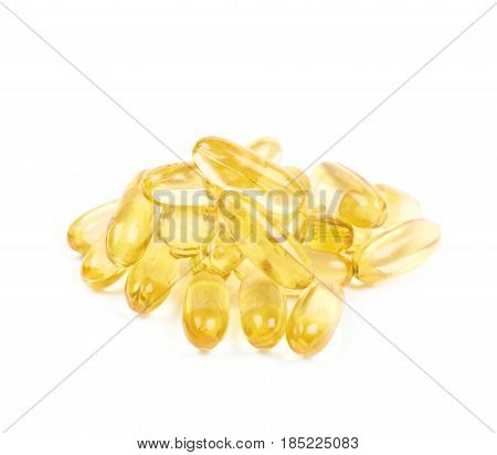 Pile of yellow softgel medical pills isolated over the white background