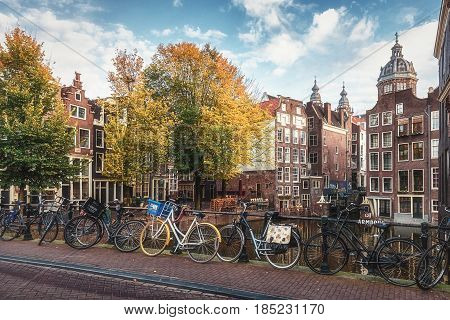 Amsterdam Netherlands - October 30 2016: The canal houses along the junction of the canals Oudezijds Voorburgwal and Oudezijds Achterburgwal in the old center of Amsterdam