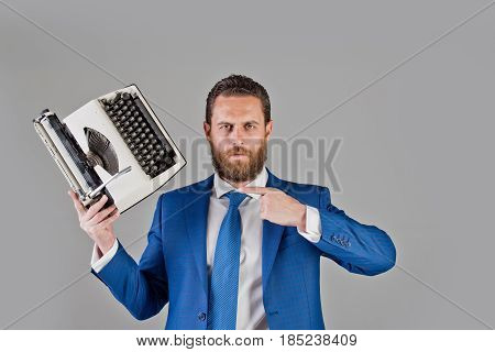 Business Man In Blue Suit And Tie With Typewriter