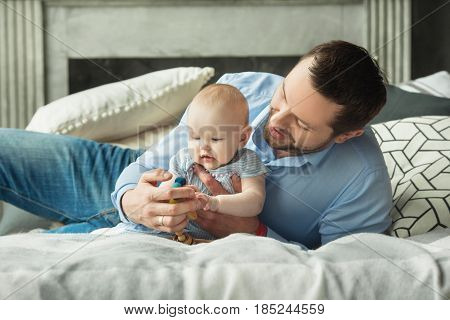 Happy dad with a little daughter of European appearance