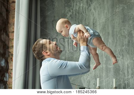 Happy dad with a little daughter of European appearance