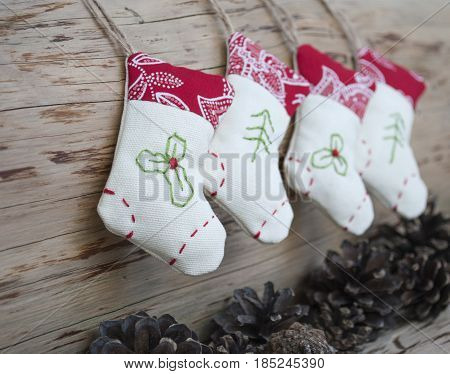 Christmas socks hanging on the white woodwall
