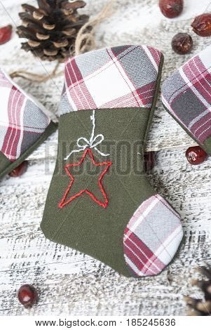 Christmas socks hanging on the white woodwall