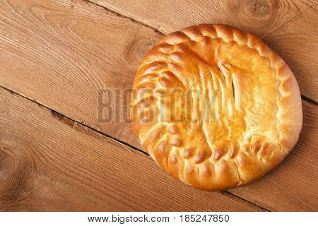 Fresh homemade fruit cake on a wooden background