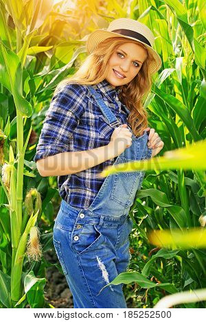 Farmer Fashion. Portrait Of Beautiful And Young, Attractive Red Haired Girl In Hat And Coveralls Pos