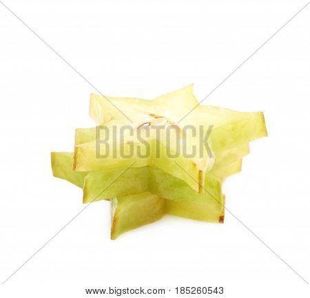 Pile of sliced carambola starfruit fruits isolated over the white background
