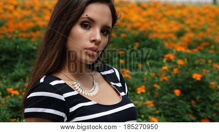 A Serious Teen Girl In A Meadow