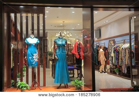HANGZHOU CHINA - NOVEMBER 5, 2016: Traditional Chinese dress shop on Qing He Fang historical street. is a protected area of the historical buildings from the Ming and Qing dynasty.