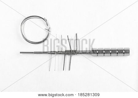 Spare Wire And Four Coils On A Micro Coil Jig, Isolated On White Background.