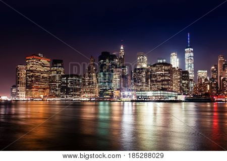 New York City Manhattan Downtown Skyline On Night Skyscrapers Illuminated Over Hudson River Panorama