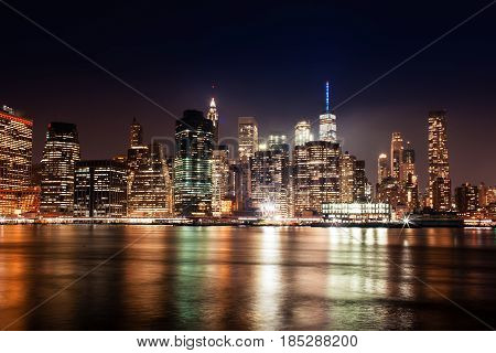 New York City Manhattan Downtown Skyline On Night Skyscrapers Illuminated Over Hudson River Panorama