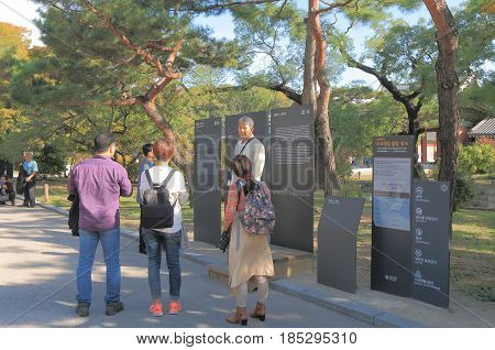 SEOUL SOUTH KOREA - OCTOBER 22, 2016: Unidentified tour guide talks to a tour group at Changdeokgung  Palace. Changdeokgung  Palace was built in15th century by King Sejong.