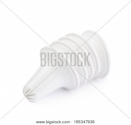 Decorational cream piping bag's plastic tip isolated over the white background
