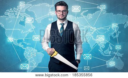 Businessman holding tool with global map graphic on the background