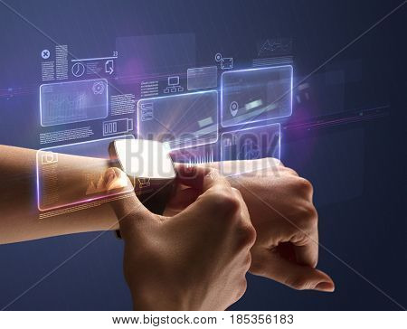 Female hand wearing smartwatch with statement labels around and dark background