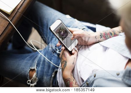 Hand Holding Mobile Phone Showing Sending Data Screen