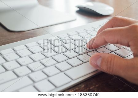 Close up Single finger press button on laptop keyboard