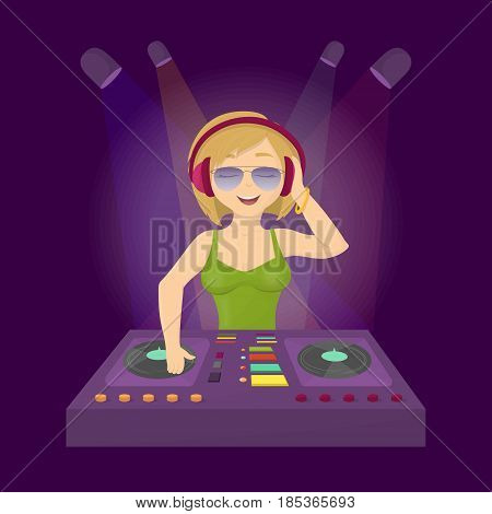 Cool dj in club. Woman in headphones djing in the dance club.